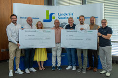 Spendenübergabe der Firma Crown an zwei Projekte des Landkreises Saarlouis